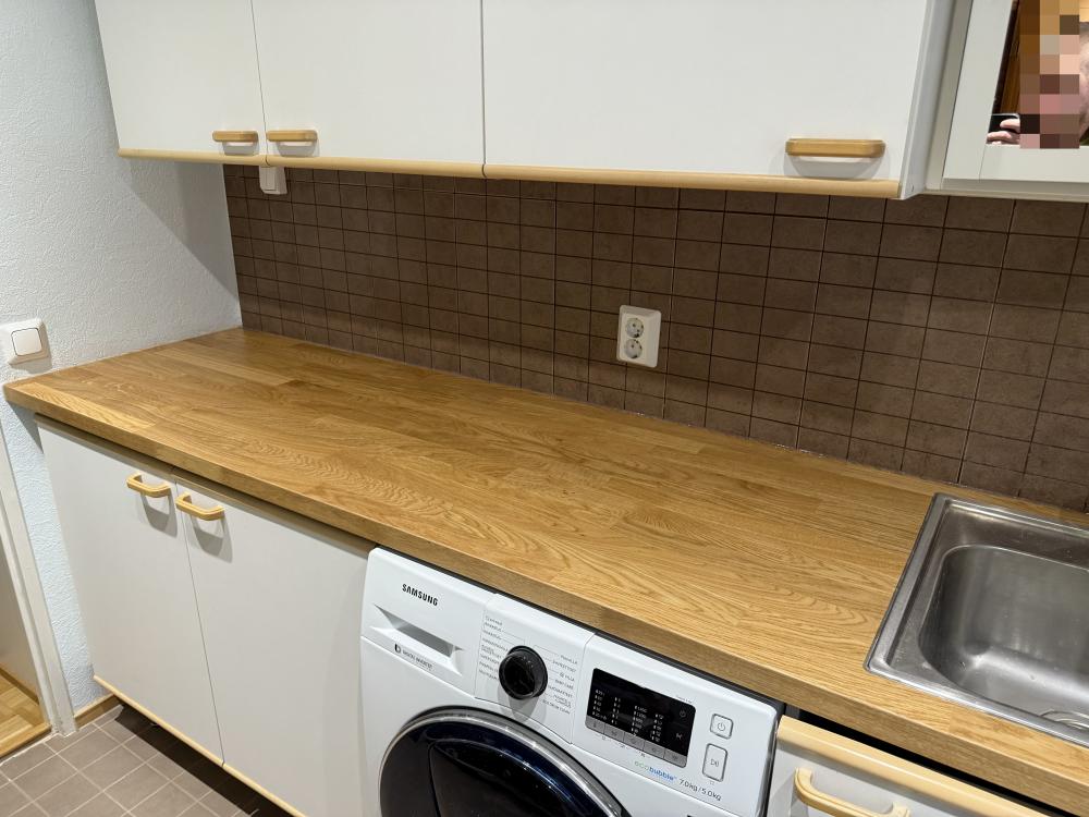 Kodinhoitohuoneen tason vaihto